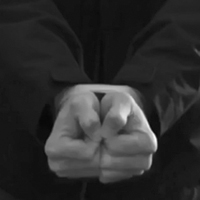 Man showing how to escape bound hands